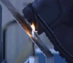 Ensaio de resistência à chama em calçado de bombeiro